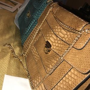Brown and teal purses
